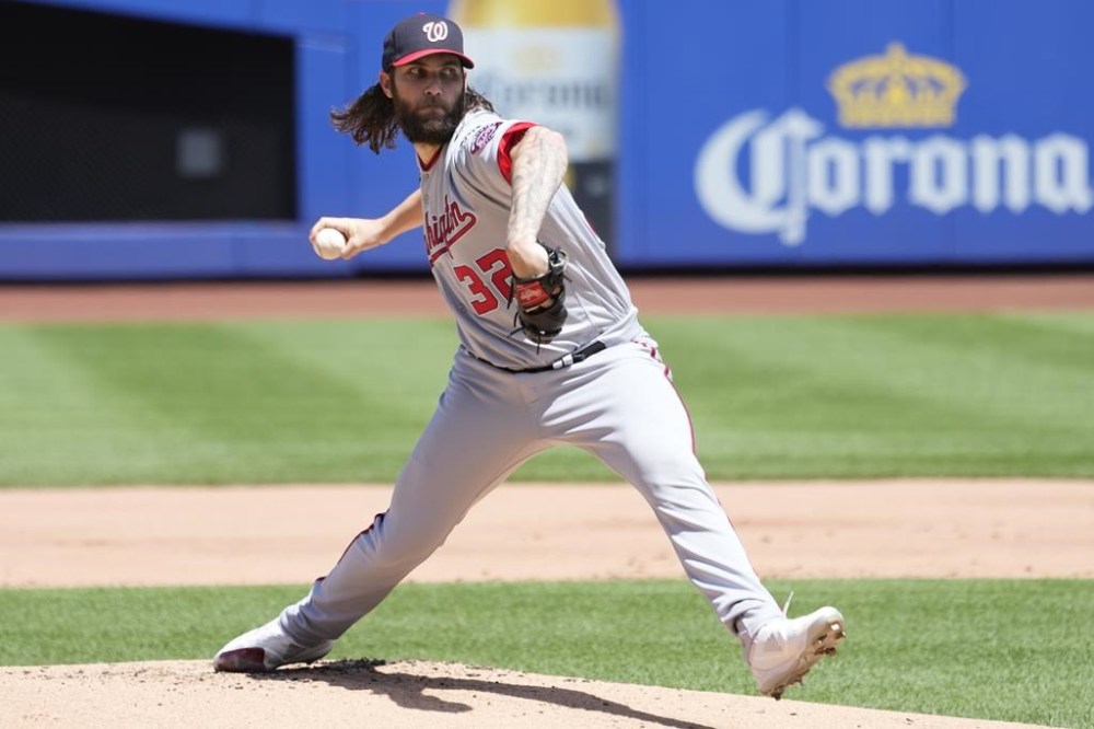 Washington Nationals pitcher Trevor Williams delivers against the New York Mets in the first inning of a baseball game, Sunday, July 30, 2023, in New York. (AP Photo/Mary Altaffer)
