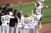 Pittsburgh Pirates' Josh Palacios (54) celebrates as he approaches home plate after hitting a two-run walk-off home run off Philadelphia Phillies relief pitcher Andrew Vasquez during the tenth inning of a baseball game in Pittsburgh, Sunday, July 30, 2023. The Pirates won 6-4. (AP Photo/Gene J. Puskar)