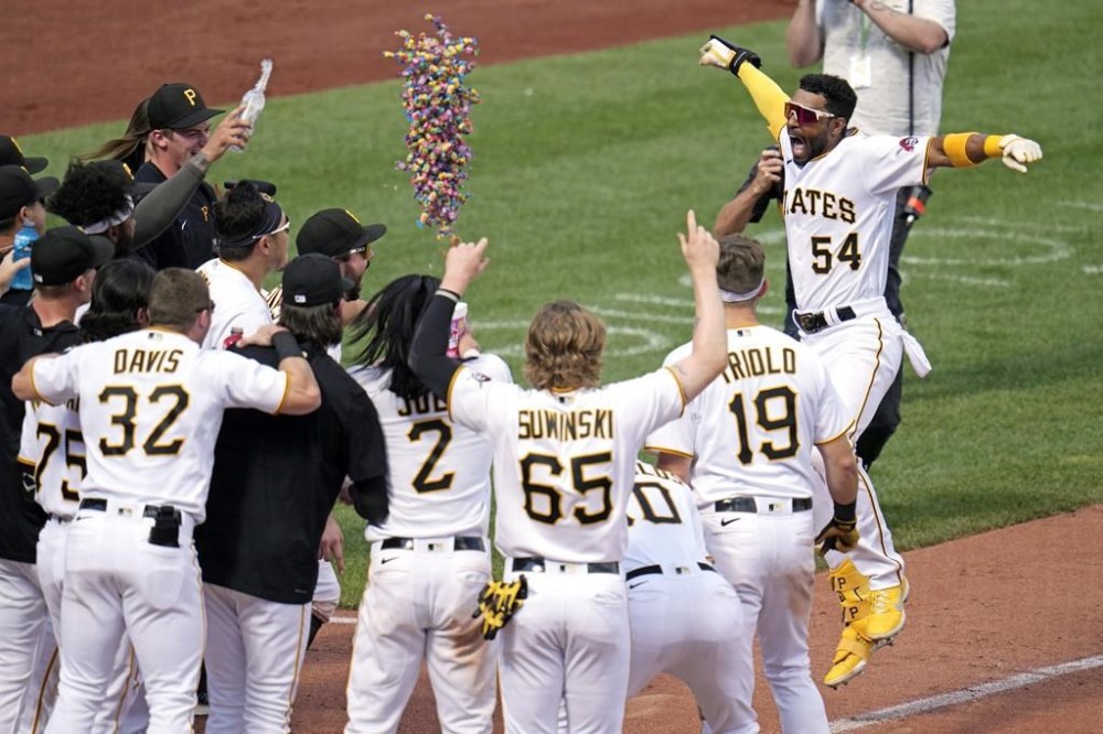 Pittsburgh Pirates' Josh Palacios (54) celebrates as he approaches home plate after hitting a two-run walk-off home run off Philadelphia Phillies relief pitcher Andrew Vasquez during the tenth inning of a baseball game in Pittsburgh, Sunday, July 30, 2023. The Pirates won 6-4. (AP Photo/Gene J. Puskar)