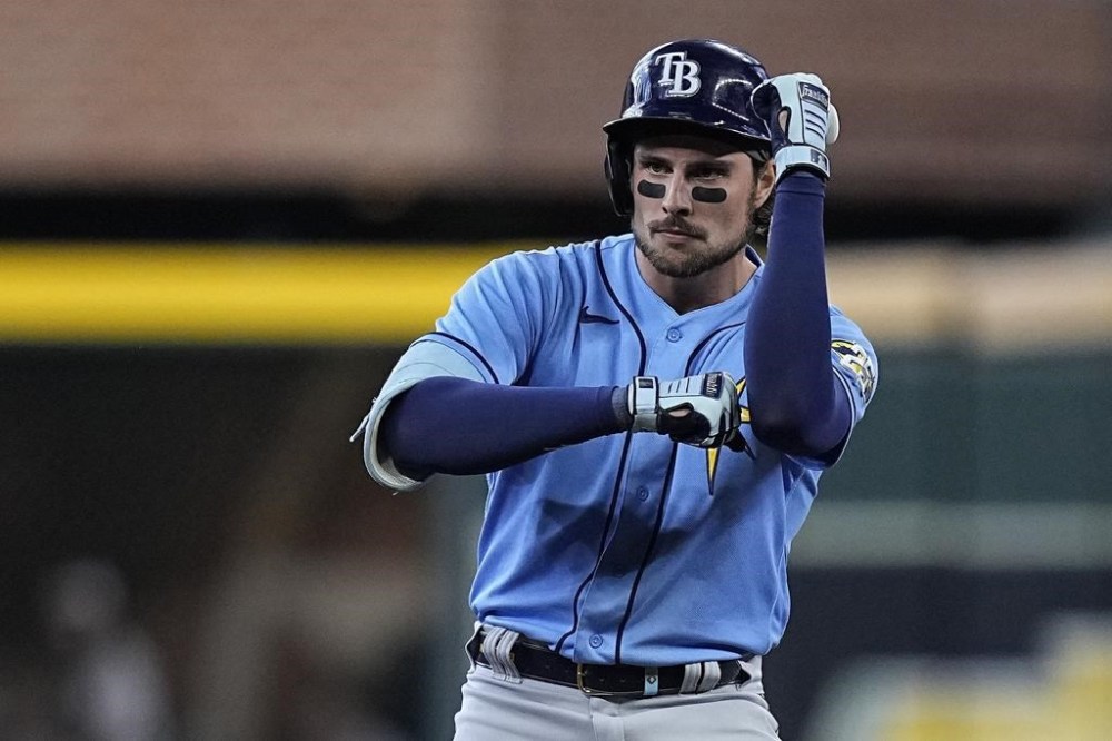 Tampa Bay Rays' Josh Lowe celebrates after hitting a three-run double during the first inning of a baseball game against the Houston Astros, Sunday, July 30, 2023, in Houston. (AP Photo/Kevin M. Cox)