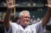 Former Colorado Rockies manager Clint Hurdle acknowledges the crowd as he is introduced during a promotion to mark the team's 30th anniversary before a baseball game against the Oakland Athletics, Sunday, July 30, 2023, in Denver. (AP Photo/David Zalubowski)