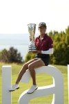 France's Celine Boutier poses with her trophy after winning the Evian Championship women's golf tournament in Evian, eastern France, Sunday, July 30, 2023. (AP Photo/Lewis Joly)