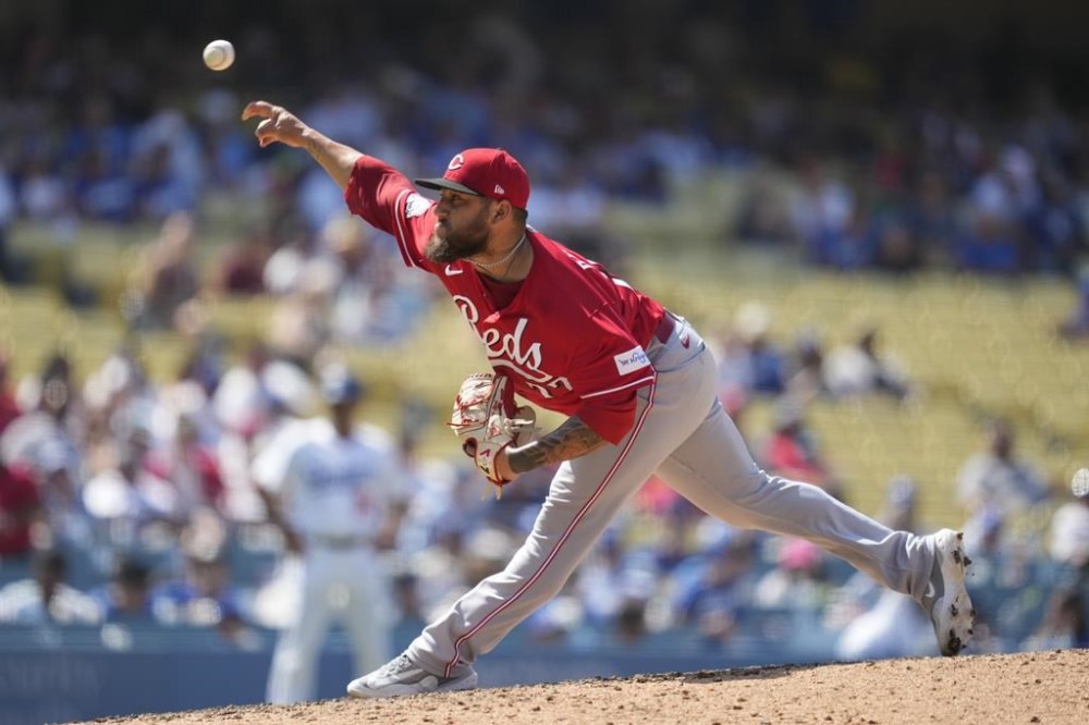 Cincinnati Reds relief pitcher Daniel Duarte (77) throws during the ninth inning of a baseball game against the Los Angeles Dodgers in Los Angeles, Sunday, July 30, 2023. (AP Photo/Ashley Landis)