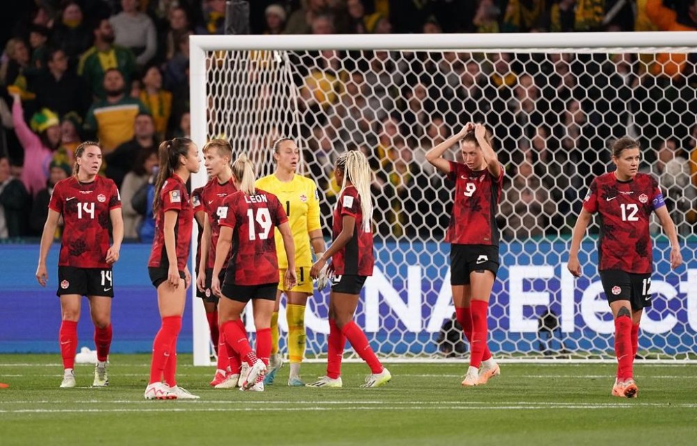 Canada’s (left to right) Vanessa Gilles, Julia Grosso, Quinn, Adriana Leon, Kailen Sheridan, Ashleigh Lawrence, Jordyn Huitema and Christine Sinclair react after conceding the second goal during first half Group B soccer action against Australia at the FIFA Women's World Cup in Melbourne, Australia, Monday, July 31, 2023. THE CANADIAN PRESS/Scott Barbour