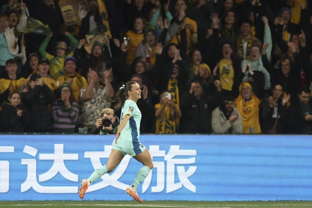Australia's Hayley Raso celebrates after scoring her side's second goal during the Women's World Cup Group B soccer match between Australia and Canada in Melbourne, Australia, Monday, July 31, 2023. (AP Photo/Hamish Blair)