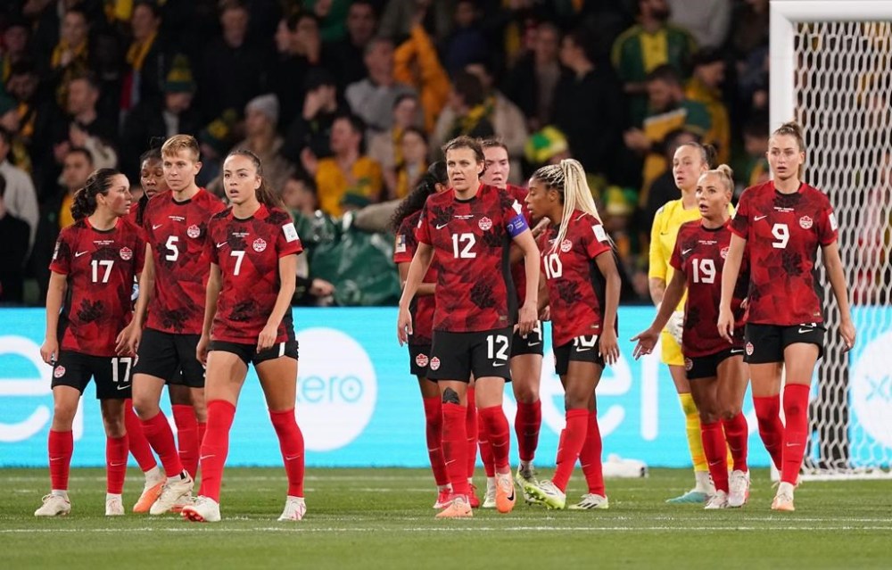 Canada’s Christine Sinclair (12) and teammates react after conceding the second goal of the first half during Group B soccer action against Australia at the FIFA Women's World Cup in Melbourne, Australia, Monday, July 31, 2023. Captain Sinclair refused to point the finger at Canada Soccer in the immediate aftermath of Olympic champion Canadians' early exit from the FIFA Women's World Cup. THE CANADIAN PRESS/Scott Barbour