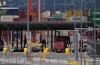 The union representing about 7,400 port workers in British Columbia and the association of employers have announced they have reached a new tentative agreement to end their long-running dispute over a collective agreement. A transport truck carries a cargo container to the Centerm Container Terminal at port in Vancouver, on Friday, July 14, 2023. THE CANADIAN PRESS/Darryl Dyck
