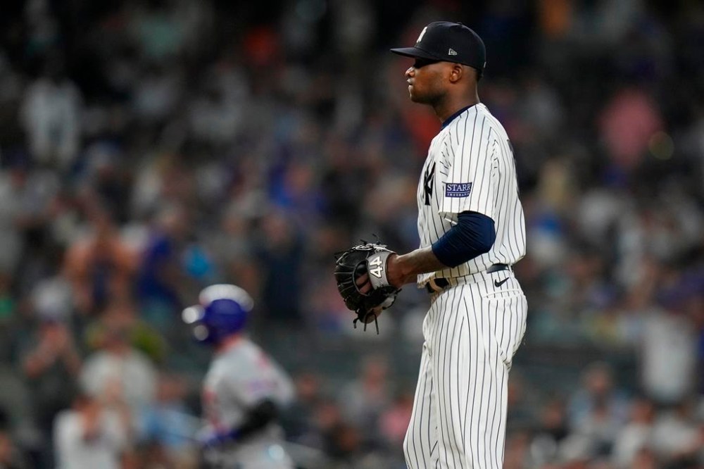 New York Yankees starting pitcher Domingo German reacts as New York Mets' Pete Alonso runs the bases after hitting a home run during the sixth inning of a baseball game, Tuesday, July 25, 2023, in New York. (AP Photo/Frank Franklin II)