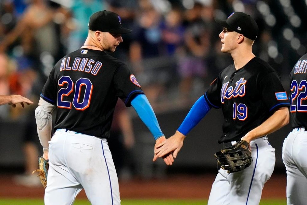 New York Mets' Pete Alonso (20) celebrates with Mark Canha (19) after the team's 5-1 win in a baseball game against the Washington Nationals on Friday, July 28, 2023, in New York. (AP Photo/Frank Franklin II)