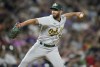 Oakland Athletics relief pitcher Sam Moll works against the Colorado Rockies in the sixth inning of a baseball game Friday, July 28, 2023, in Denver. (AP Photo/David Zalubowski)