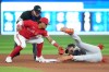 Baltimore Orioles third baseman Gunnar Henderson (2) is safe at second base after Toronto Blue Jays' Santiago Espinal (5) misses the tag during seventh inning American League MLB baseball action in Toronto on Monday, July 31, 2023. THE CANADIAN PRESS/Nathan Denette