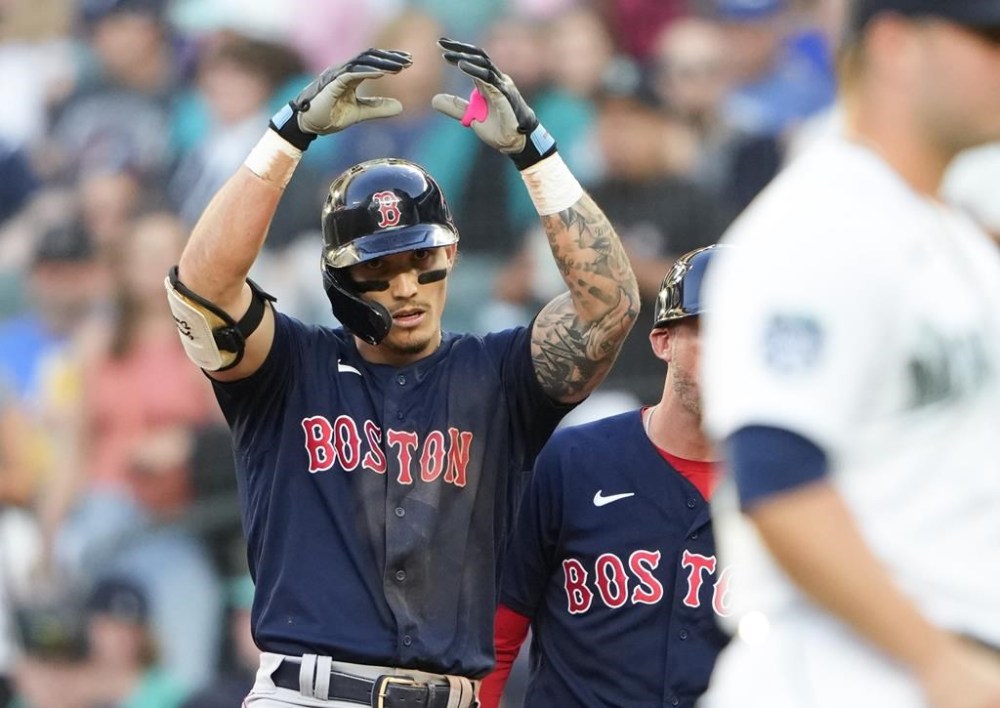 Boston Red Sox's Jarren Duran gestures after hitting a single against Seattle Mariners starting pitcher George Kirby during the fifth inning of a baseball game, Monday, July 31, 2023, in Seattle. (AP Photo/Lindsey Wasson)