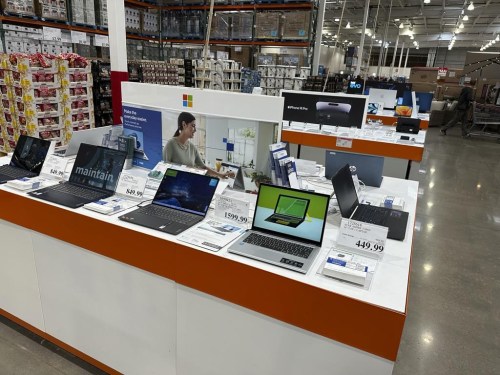 Laptop computers are shown on display in a Costco warehouse on Monday, June 6, 2023, in Colorado Springs, Colo. Laptop prices range from $300 to $3,000, according to Toronto-based tech consultant Avery Swartz. But now is a good time to buy. “August is the best time of year to buy a laptop because it's when all the deals are on,” she adds. THE CANADIAN PRESS/AP/David Zalubowski)