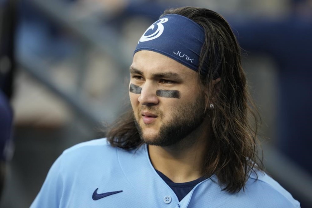Blue Jays all-star shortstop Bo Bichette is day to day with right knee discomfort. Bichette walks in the dugout before a baseball game against the Los Angeles Dodgers, in Los Angeles, Tuesday, July 25, 2023. THE CANADIAN PRESS/AP-Marcio Jose Sanchez