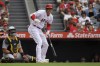 Los Angeles Angels' Shohei Ohtani, right, reacts after hitting a foul ball toward the photo well as Pittsburgh Pirates catcher Austin Hedges watches during the first inning of a baseball game, Sunday, July 23, 2023, in Anaheim, Calif. (AP Photo/Mark J. Terrill)