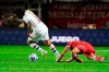Luciano Sánchez of Argentina's Argentinos Juniors, right, falls injured during a play against Marcelo of Brazil's Fluminense, left, during a Copa Libertadores round of 16 first leg soccer match at Diego Armando Maradona stadium in Buenos Aires, Argentina, Tuesday, Aug. 1, 2023. (AP Photo/Ivan Fernandez)