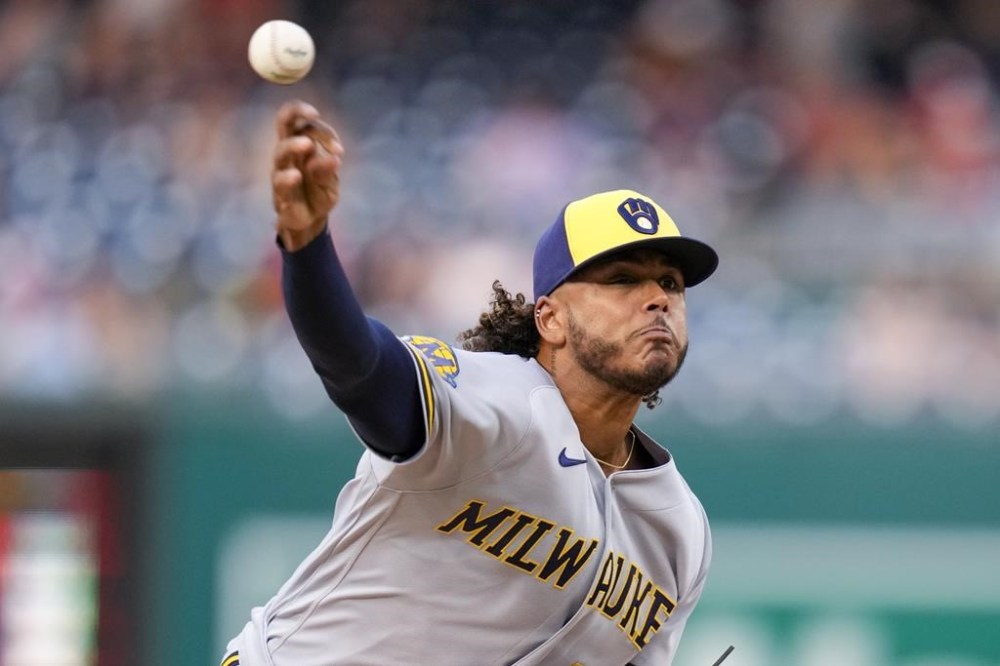 Milwaukee Brewers starting pitcher Freddy Peralta throws during the first inning of a baseball game against the Washington Nationals at Nationals Park, Tuesday, Aug. 1, 2023, in Washington. (AP Photo/Alex Brandon)