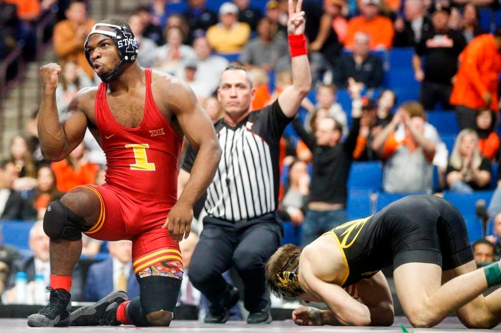 FILE - Iowa State's Paniro Johnson celebrates after defeating Missouri's Brock Mauller during the championship round of the Big 12 Wrestling Championships at the BOK Center on March 5, 2023, in Tulsa, Okla. Johnson was one of three current or former Iowa State athletes accused of gambling on Cyclones sporting events, according to a criminal complaint, and faces a charge of tampering with records related to an Iowa Criminal Division investigation into sports gambling. (Ian Maule/Tulsa World via AP, File)