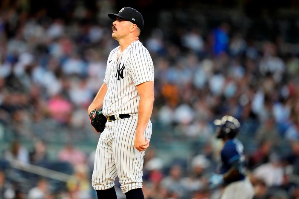 New York Yankees starting pitcher Carlos Rodon reacts as Tampa Bay Rays' Randy Arozarena runs the bases after hitting a two-run home run during the third inning of a baseball game Tuesday, Aug. 1, 2023, in New York. (AP Photo/Frank Franklin II)