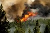 Flames from the Donnie Creek wildfire burn along a ridge top north of Fort St. John, British Columbia, Canada, Sunday, July 2, 2023. A fundraiser has been launched to honour the memory of a firefighter killed while fighting British Columbia's largest wildfire last week.THE CANADIAN PRESS/AP, Noah Berger
