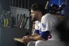 Los Angeles Dodgers starting pitcher Lance Lynn sits in the dugout during the fourth inning of a baseball game against the Oakland Athletics Tuesday, Aug. 1, 2023, in Los Angeles. (AP Photo/Mark J. Terrill)