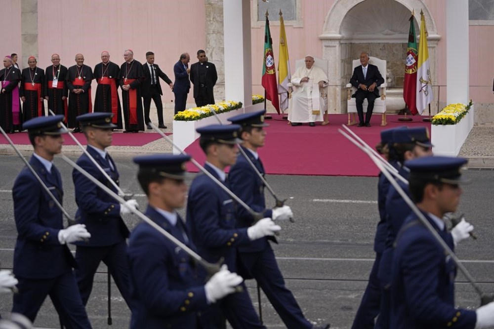 Pope Francis and Portugal's President Marcelo Rebelo de Sousa, right watch an honor guard at the Welcome Ceremony at the Belem presidential palace in Lisbon, Wednesday, Aug. 2, 2023. Pope Francis starts his five-day pastoral visit to Portugal Wednesday that includes his participation at the 37th World Youth Day, and a pilgrimage to the holy shrine of Fatima. (AP Photo/Armando Franca)