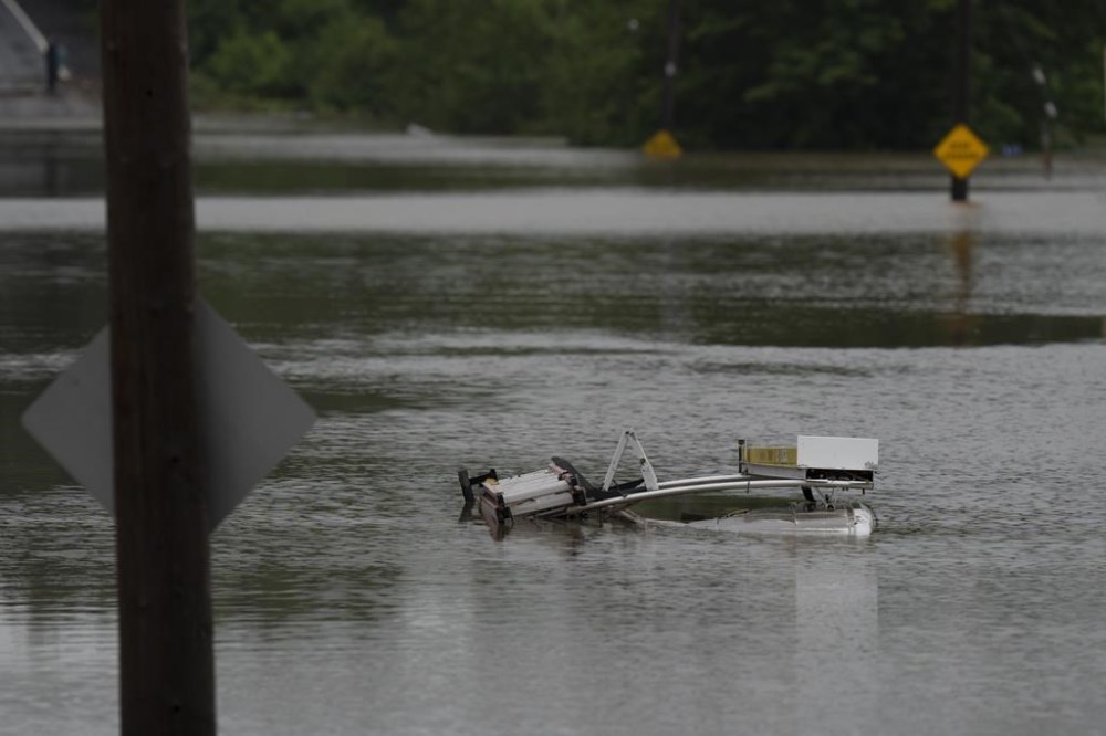 The top of a service truck is seen abandoned in floodwater following a major rain event in Halifax on Saturday, July 22, 2023. THE CANADIAN PRESS/Darren Calabrese