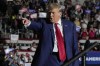 FILE - Republican presidential candidate, former President Donald Trump arrives for a campaign rally, July 29, 2023, in Erie, Pa. The indictment of Donald Trump for attempting to overturn his election defeat is a new front in what Joe Biden has described as the battle for American democracy. It's the issue that Biden has described as the most consequential struggle of his presidency. The criminal charges are a reminder of the stakes of next year's campaign, when Trump is hoping for a rematch with Biden. (AP Photo/Sue Ogrocki, File)