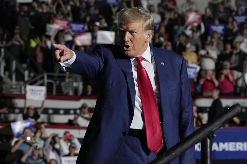 FILE - Republican presidential candidate, former President Donald Trump arrives for a campaign rally, July 29, 2023, in Erie, Pa. The indictment of Donald Trump for attempting to overturn his election defeat is a new front in what Joe Biden has described as the battle for American democracy. It's the issue that Biden has described as the most consequential struggle of his presidency. The criminal charges are a reminder of the stakes of next year's campaign, when Trump is hoping for a rematch with Biden. (AP Photo/Sue Ogrocki, File)
