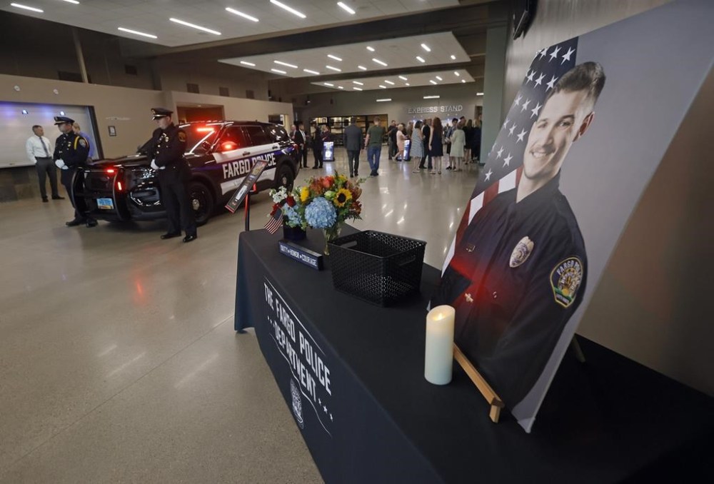 Guests arrive for the Celebration of Life service for Fargo Police Officer Jake Wallin at Scheels Arena on Wednesday, July 26, 2023 in Fargo. N.D.. Wallin was killed July 14 when a man armed with 1,800 rounds of ammunition, multiple guns and explosives ambushed officers responding to a routine traffic crash. (David Samson/Forum Communications Co. via AP, Pool)