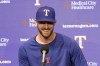 Chris Stratton, a pitcher who was acquired during a trade by the Texas Rangers, responds to questions during a news conference before a baseball game against the Chicago White Sox, Tuesday, Aug. 1, 2023, in Arlington, Texas. (AP Photo/Tony Gutierrez)