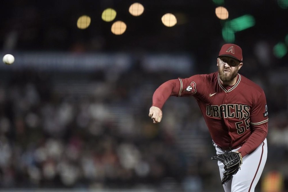Arizona Diamondbacks pitcher Austin Adams throws to a San Francisco Giants batter during the eighth inning of a baseball game Tuesday, Aug. 1, 2023, in San Francisco. (AP Photo/Godofredo A. Vásquez)