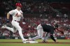 St. Louis Cardinals' Tyler O'Neill, left, grounds out as Minnesota Twins first baseman Joey Gallo handles the throw during the fifth inning of a baseball game Wednesday, Aug. 2, 2023, in St. Louis. (AP Photo/Jeff Roberson)