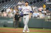 New York Mets starting pitcher Kodai Senga, from Japan, prepares to throw during the first inning of a baseball game against the Kansas City Royals Wednesday, Aug. 2, 2023, in Kansas City, Mo. (AP Photo/Charlie Riedel)