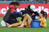 South Korea's goalkeeper Kim Jung-mi, right, receives treatment from trainers during the Women's World Cup Group H soccer match between South Korea and Germany in Brisbane, Australia, Thursday, Aug. 3, 2023. (AP Photo/Tertius Pickard)