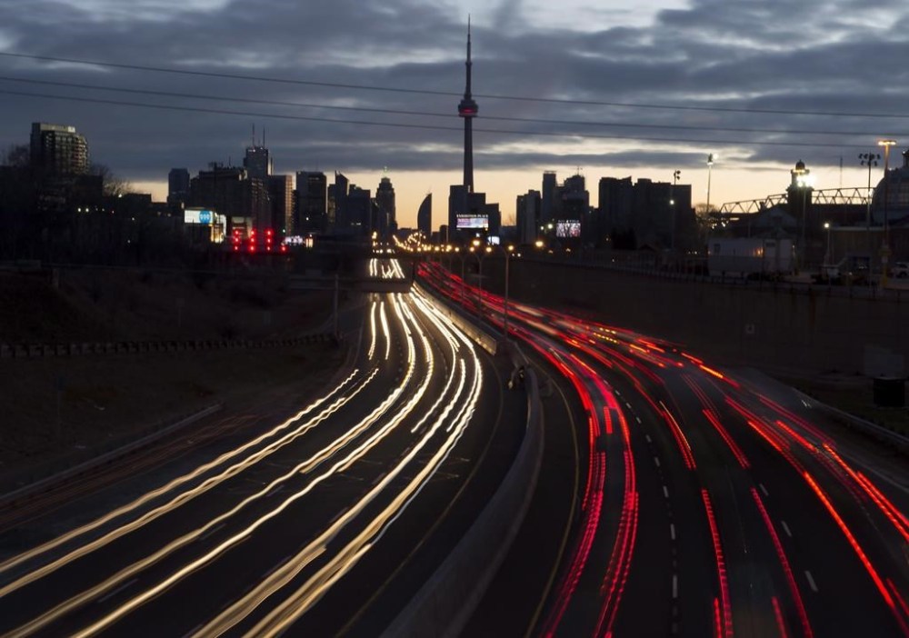 The headlights and taillights of vehicles are shown as commuters travel into Toronto on the Gardiner Expressway on Friday Jan. 27, 2017. The regulator for Ontario