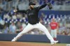 Miami Marlins starting pitcher Johnny Cueto aims a pitch during the first inning of a baseball game against the Philadelphia Phillies, Thursday, Aug. 3, 2023, in Miami. (AP Photo/Marta Lavandier)