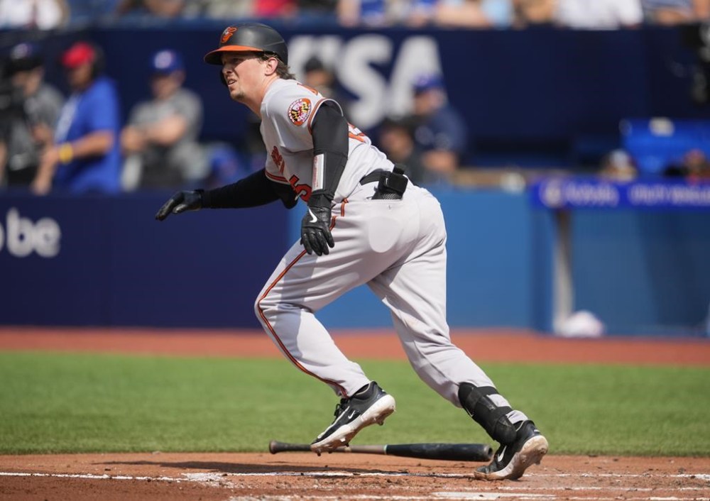 Baltimore Orioles catcher Adley Rutschman (35) hits a RBI single against the Toronto Blue Jays during the second inning of MLB baseball action in Toronto on Thursday August 3, 2023.  THE CANADIAN PRESS/Mark Blinch