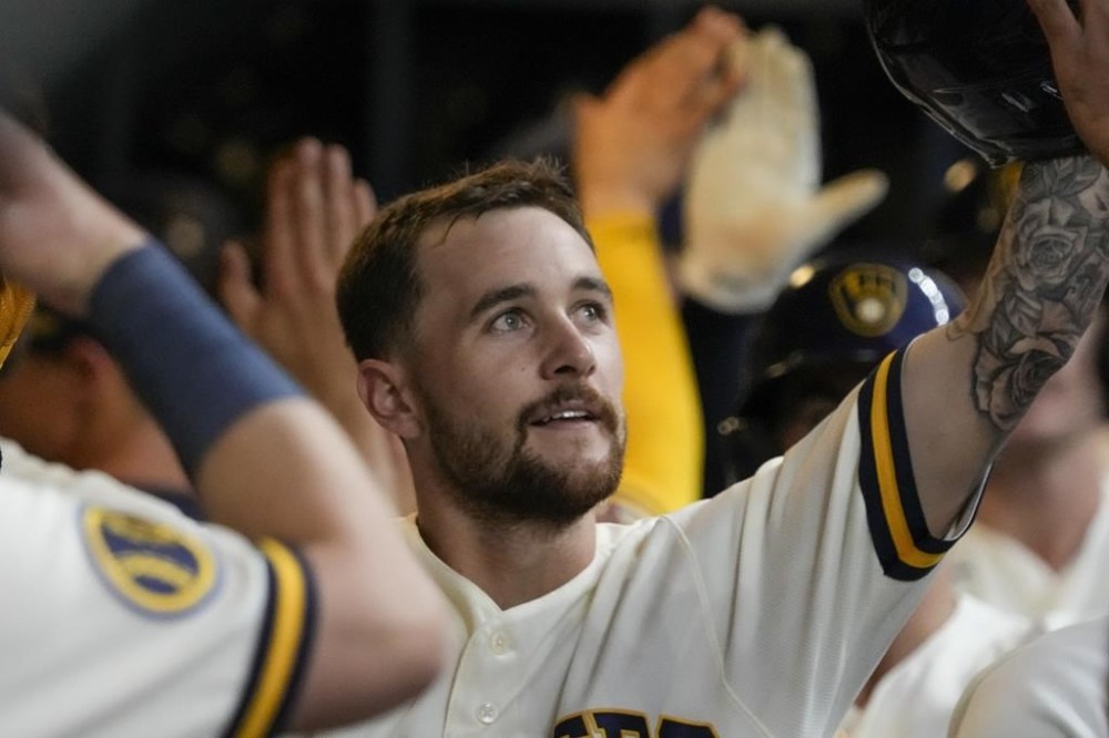 Milwaukee Brewers' Brice Turang is congratulated after hitting a three-run home run during the fifth inning of a baseball game against the Pittsburgh Pirates Thursday, Aug. 3, 2023, in Milwaukee. (AP Photo/Morry Gash)