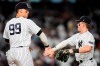 New York Yankees' Aaron Judge, left, celebrates with Harrison Bader after the team's 4-3 win in a baseball game against the Houston Astros on Thursday, Aug. 3, 2023, in New York. (AP Photo/Frank Franklin II)