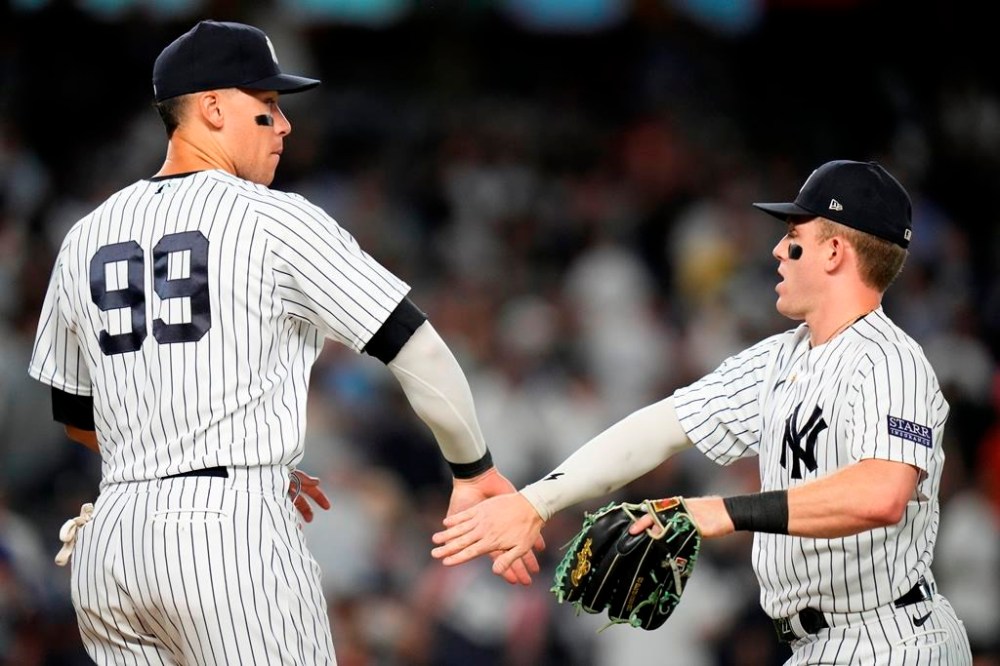 New York Yankees' Aaron Judge, left, celebrates with Harrison Bader after the team's 4-3 win in a baseball game against the Houston Astros on Thursday, Aug. 3, 2023, in New York. (AP Photo/Frank Franklin II)