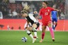 Germany's Kathrin Hendrich, left, and South Korea's Casey Phair compete for the ball during the Women's World Cup Group H soccer match between South Korea and Germany in Brisbane, Australia, Thursday, Aug. 3, 2023. (AP Photo/Tertius Pickard)