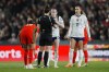 United States' Rose Lavelle, center, talks with a referee after receiving a yellow card during the first half of the FIFA Women's World Cup Group E soccer match between Portugal and the United States at Eden Park in Auckland, New Zealand, Tuesday, Aug. 1, 2023. (AP Photo/Abbie Parr)