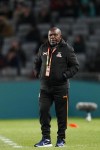Zambia's head coach Bruce Mwape stands by the touchline during the Women's World Cup Group C soccer match between Spain and Zambia at Eden Park in Auckland, New Zealand, Wednesday, July 26, 2023. (AP Photo/Abbie Parr)