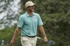 Adam Scott, of Australia, smiles after making a birdie putt on the first hole during the second round of the Wyndham Championship golf tournament in Greensboro, N.C., Friday, Aug. 4, 2023. (AP Photo/Chuck Burton)