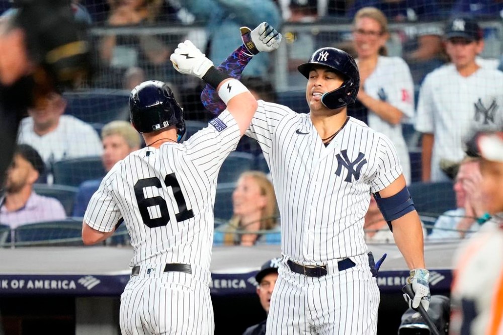 New York Yankees' Jake Bauers, left, celebrates with Giancarlo Stanton after hitting a home run against the Houston Astros during the third inning of a baseball game Friday, Aug. 4, 2023, in New York. (AP Photo/Frank Franklin II)