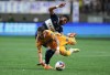 Tigres' Fernando Gorriaran, front, is upended by Vancouver Whitecaps' Pedro Vite as they vie for the ball during the first half of a Leagues Cup soccer match in Vancouver, on Friday, August 4, 2023. THE CANADIAN PRESS/Darryl Dyck