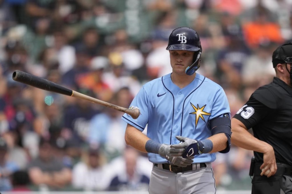Tampa Bay Rays' Curtis Mead tosses his bat after being hit by a pitch during the sixth inning of a baseball game against the Detroit Tigers, Saturday, Aug. 5, 2023, in Detroit. (AP Photo/Carlos Osorio)