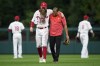 Philadelphia Phillies' Brandon Marsh is helped off the field after an injury during the fifth inning of a baseball game against the Kansas City Royals, Saturday, Aug. 5, 2023, in Philadelphia. (AP Photo/Matt Slocum)