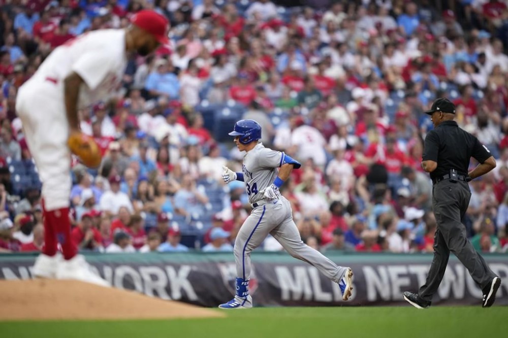 Kansas City Royals' Freddy Fermin, center, rounds the bases after hitting a home run against Philadelphia Phillies pitcher Cristopher Sanchez during the fourth inning of a baseball game, Saturday, Aug. 5, 2023, in Philadelphia. (AP Photo/Matt Slocum)